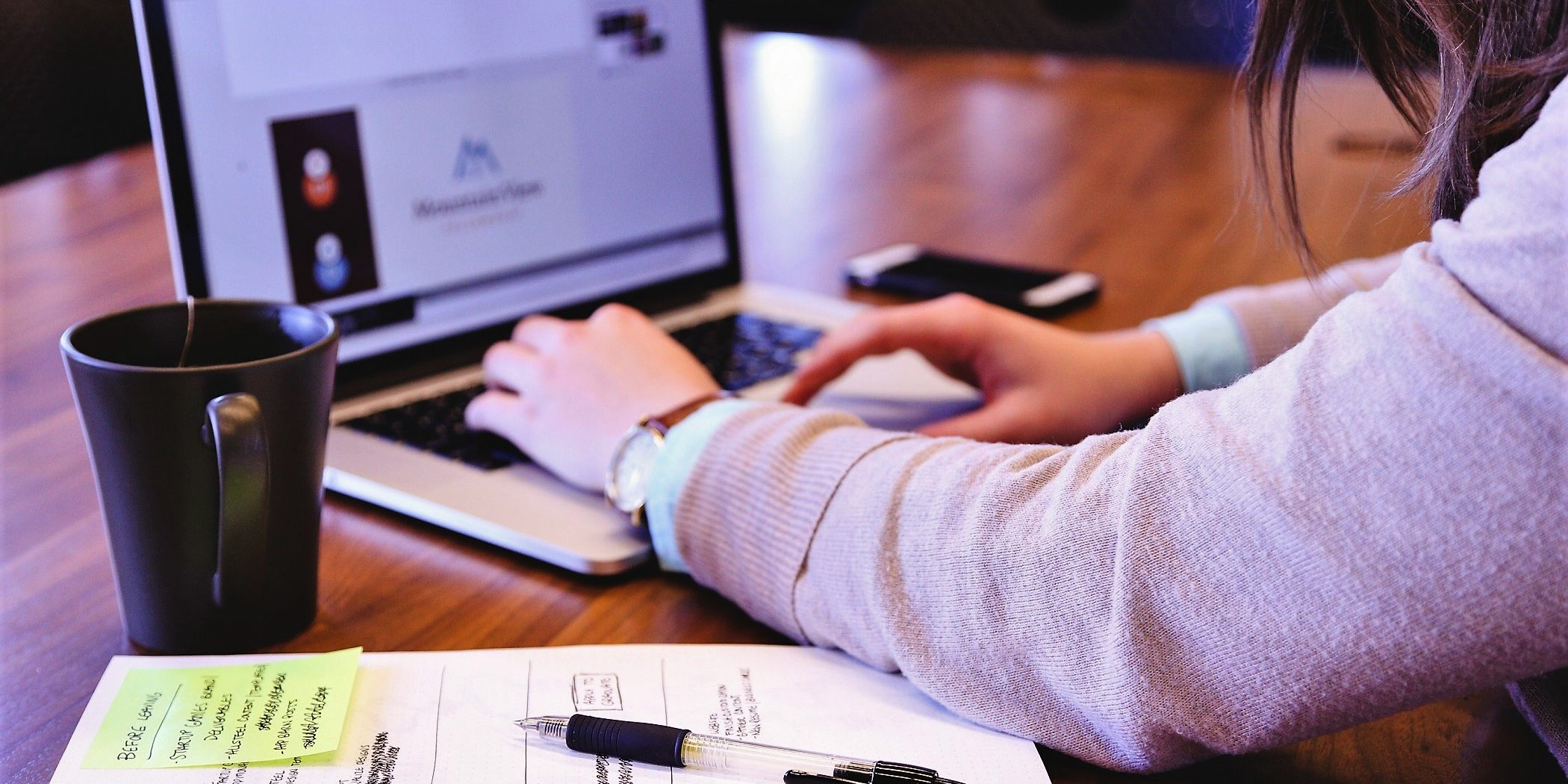 Girl typing on laptop
